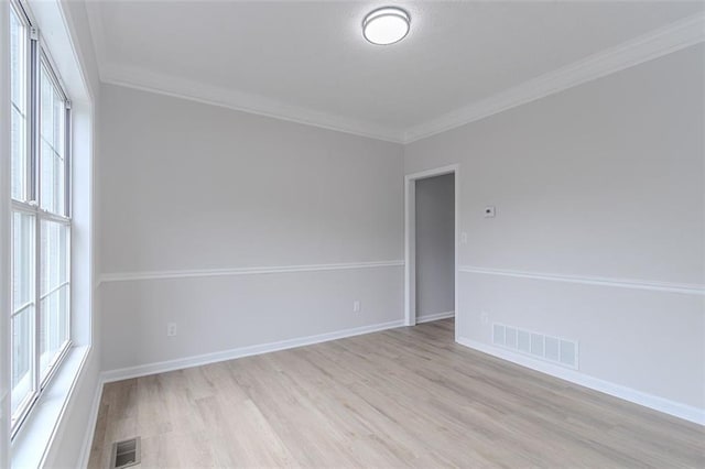 1706 Brandon Lee Way SW, Marietta, GA 30008 - empty room featuring light wood-style flooring, crown molding, and baseboards