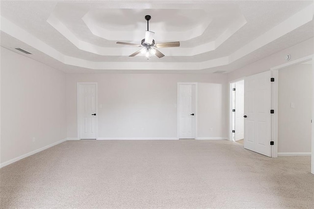 1706 Brandon Lee Way SW, Marietta, GA 30008 - empty room featuring a tray ceiling, light colored carpet, and ceiling fan