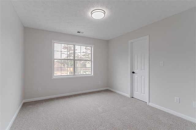 1706 Brandon Lee Way SW, Marietta, GA 30008 - spare room featuring carpet flooring, baseboards, and a textured ceiling