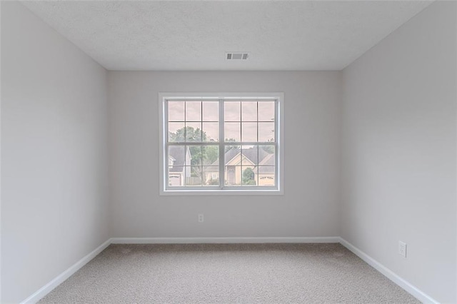 1706 Brandon Lee Way SW, Marietta, GA 30008 - spare room featuring carpet flooring, baseboards, and a textured ceiling