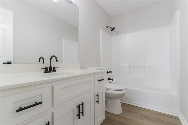 1706 Brandon Lee Way SW, Marietta, GA 30008 - bathroom featuring toilet, vanity, wood finished floors, and bathing tub / shower combination