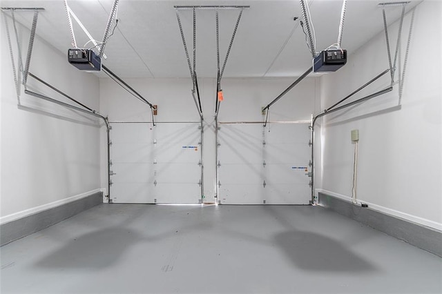 1706 Brandon Lee Way SW, Marietta, GA 30008 - garage featuring a garage door opener and baseboards