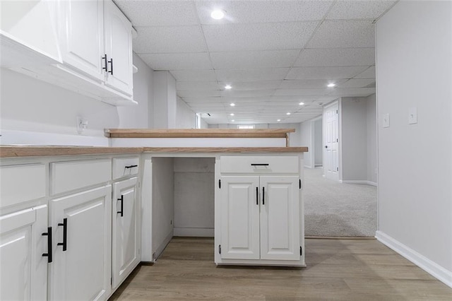 1706 Brandon Lee Way SW, Marietta, GA 30008 - kitchen with a peninsula, white cabinetry, baseboards, recessed lighting, and a paneled ceiling