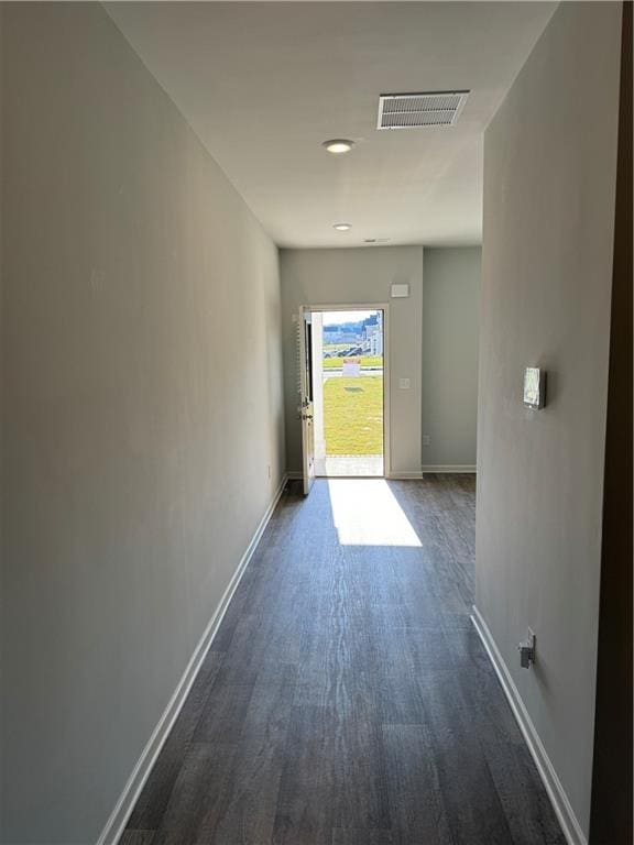 hall with dark hardwood / wood-style flooring