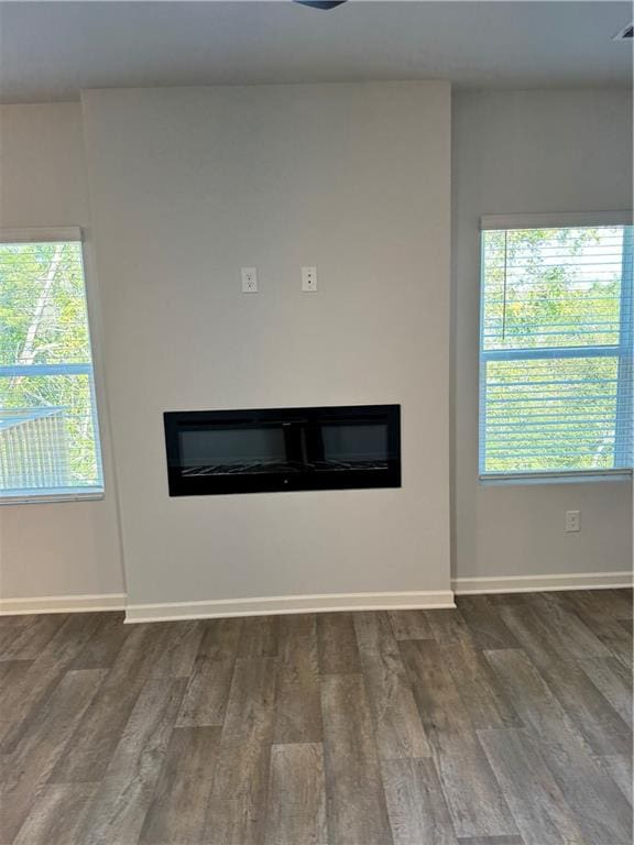 empty room with dark hardwood / wood-style floors