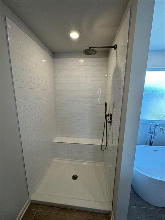 bathroom featuring separate shower and tub and tile patterned flooring