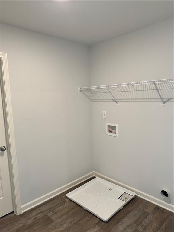 laundry area featuring washer hookup and dark wood-type flooring