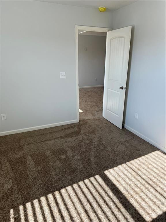 empty room featuring carpet flooring