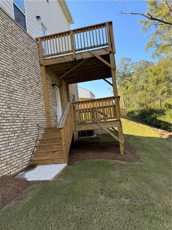 wooden terrace with a lawn