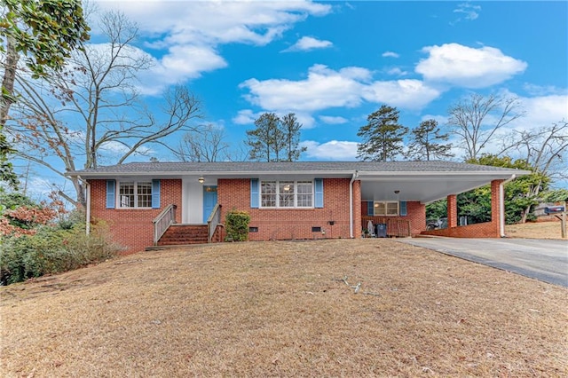 ranch-style home with a front lawn and a carport