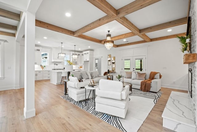 living area with baseboards, beamed ceiling, recessed lighting, and light wood-type flooring