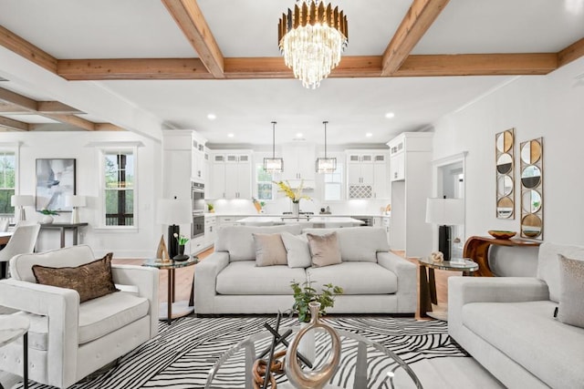 living room with an inviting chandelier, recessed lighting, and beam ceiling