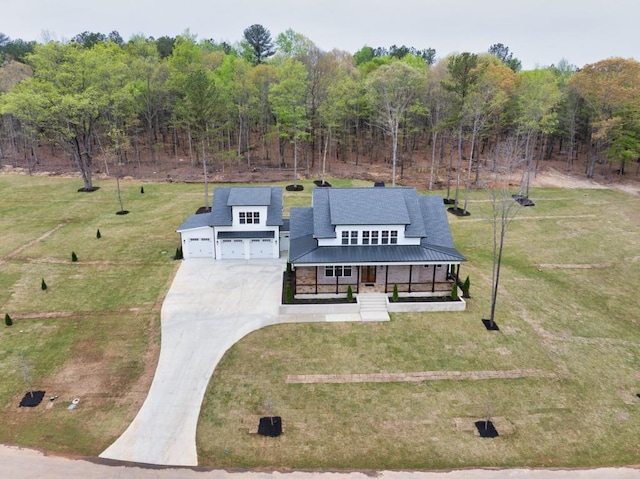 aerial view featuring a wooded view