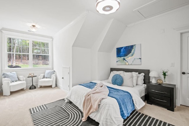 carpeted bedroom featuring ornamental molding, attic access, and lofted ceiling