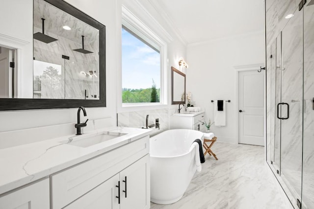 bathroom with vanity, a freestanding tub, a marble finish shower, crown molding, and marble finish floor