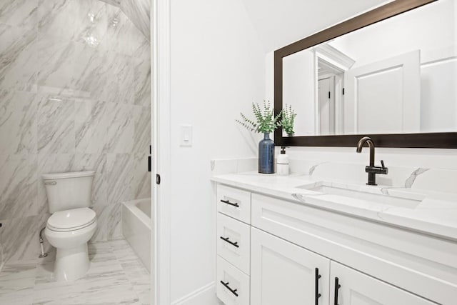 full bath with marble finish floor, toilet, and vanity