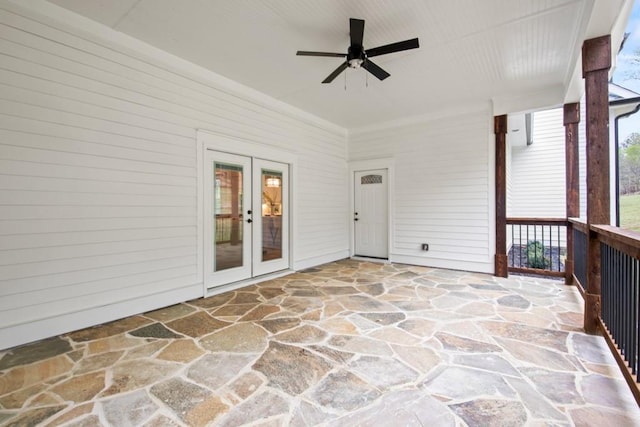 unfurnished sunroom featuring french doors