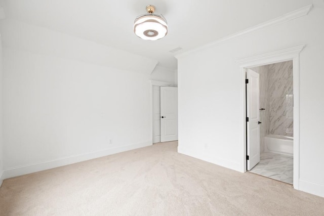 unfurnished bedroom with baseboards, ornamental molding, and carpet