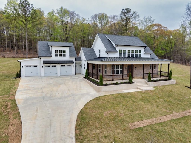 modern farmhouse style home featuring driveway, an attached garage, a porch, and a front yard