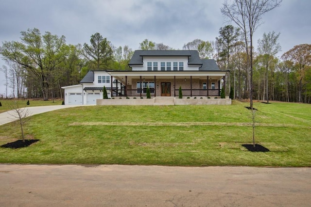 view of front of house with a front lawn, an attached garage, a porch, and concrete driveway