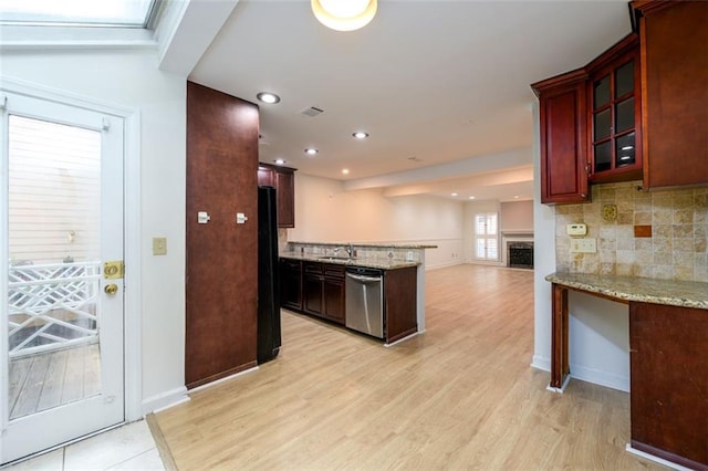 7500 Roswell Rd Unit 18, Sandy Springs, GA 30350 - kitchen featuring stainless steel dishwasher, a peninsula, open floor plan, light wood-type flooring, and recessed lighting