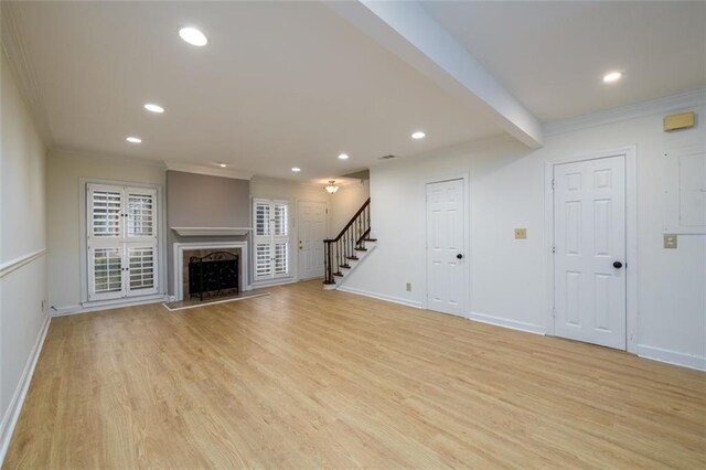 7500 Roswell Rd Unit 18, Sandy Springs, GA 30350 - unfurnished living room featuring ornamental molding, stairs, recessed lighting, light wood-style floors, and baseboards