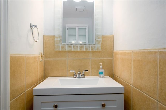7500 Roswell Rd Unit 18, Sandy Springs, GA 30350 - bathroom featuring tile walls, vanity, and a wainscoted wall