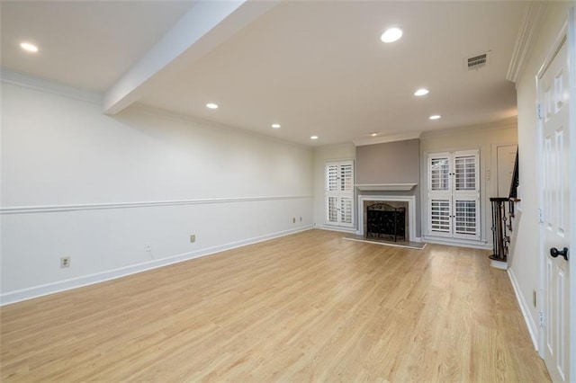 7500 Roswell Rd Unit 18, Sandy Springs, GA 30350 - unfurnished living room featuring ornamental molding, recessed lighting, light wood-style floors, baseboards, and a fireplace