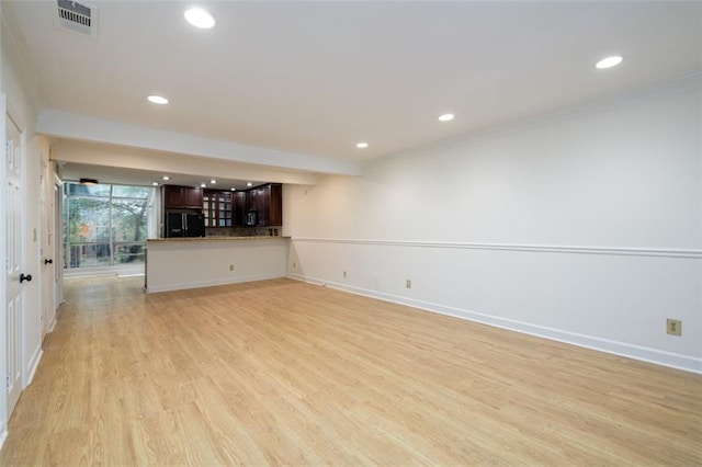 7500 Roswell Rd Unit 18, Sandy Springs, GA 30350 - unfurnished living room featuring recessed lighting, light wood-style floors, crown molding, and baseboards