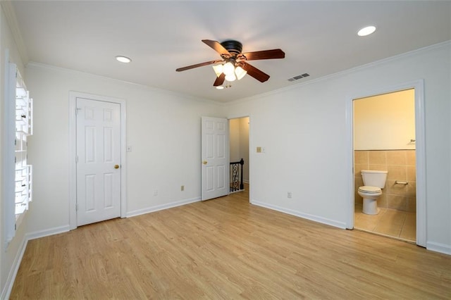 7500 Roswell Rd Unit 18, Sandy Springs, GA 30350 - unfurnished bedroom with light wood-style floors, crown molding, ensuite bathroom, tile walls, and recessed lighting