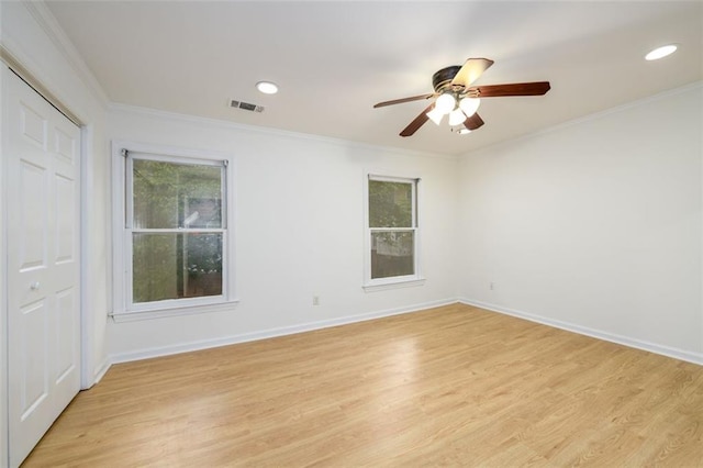 7500 Roswell Rd Unit 18, Sandy Springs, GA 30350 - spare room featuring plenty of natural light, ornamental molding, light wood finished floors, a ceiling fan, and baseboards