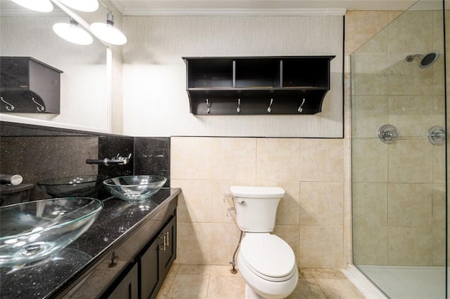 7500 Roswell Rd Unit 18, Sandy Springs, GA 30350 - bathroom featuring a shower stall, double vanity, toilet, crown molding, and tile walls