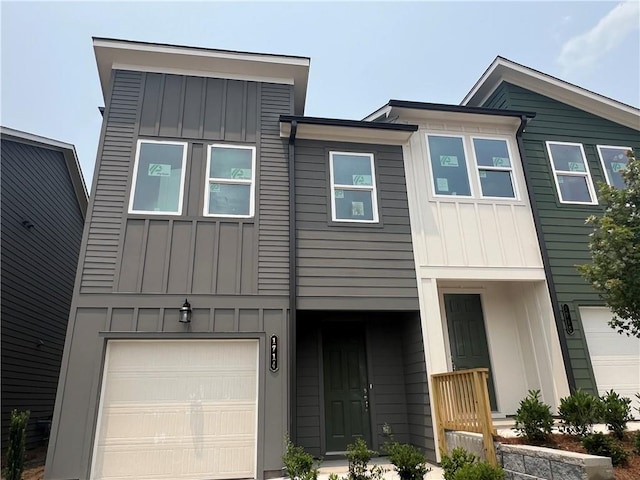 1714 Gunnin Trce NW, Atlanta, GA 30318 - view of front of home with board and batten siding and an attached garage