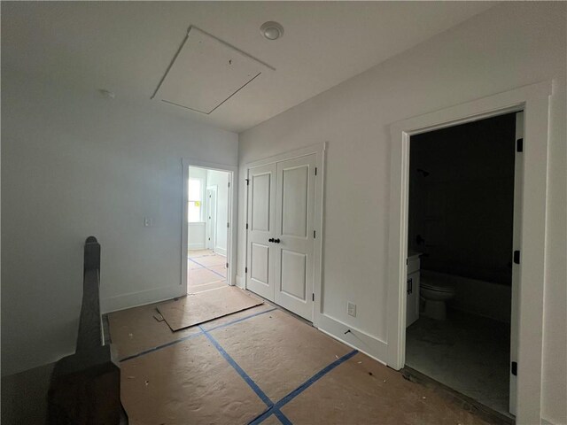 1714 Gunnin Trce NW, Atlanta, GA 30318 - unfurnished bedroom featuring attic access, baseboards, and ensuite bathroom
