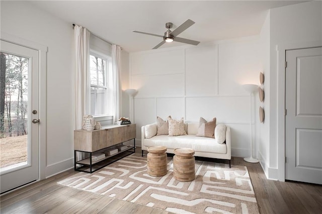 1714 Gunnin Trce NW, Atlanta, GA 30318 - sitting room with a decorative wall, a ceiling fan, and wood finished floors