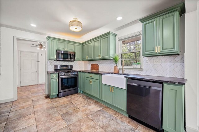 1286 Calhoun Ter SW, Atlanta, GA 30314 - kitchen featuring green cabinetry, backsplash, a sink, stainless steel appliances, and dark countertops
