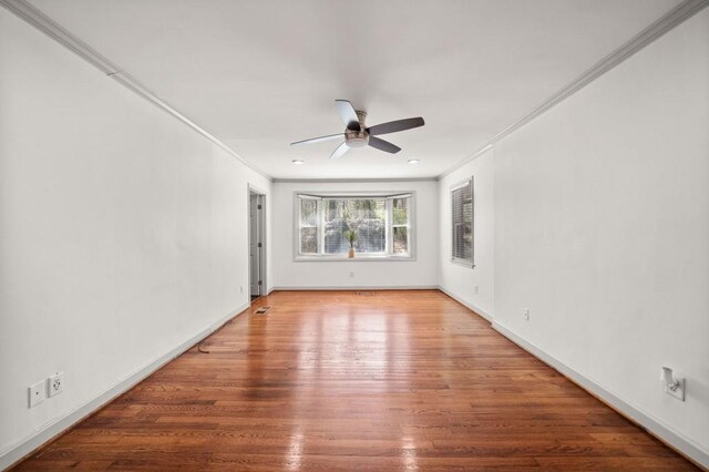 1286 Calhoun Ter SW, Atlanta, GA 30314 - empty room featuring baseboards, crown molding, wood finished floors, and a ceiling fan