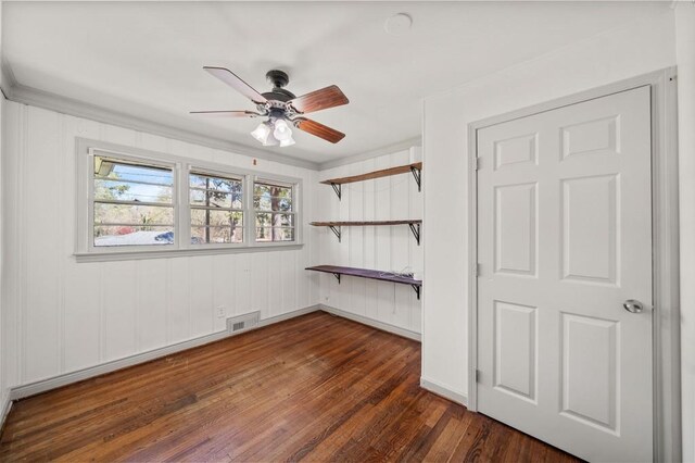 1286 Calhoun Ter SW, Atlanta, GA 30314 - empty room featuring dark wood-type flooring, ornamental molding, visible vents, and a ceiling fan