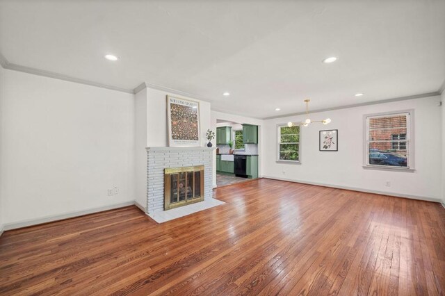 1286 Calhoun Ter SW, Atlanta, GA 30314 - unfurnished living room with recessed lighting, wood-type flooring, ornamental molding, baseboards, and a fireplace