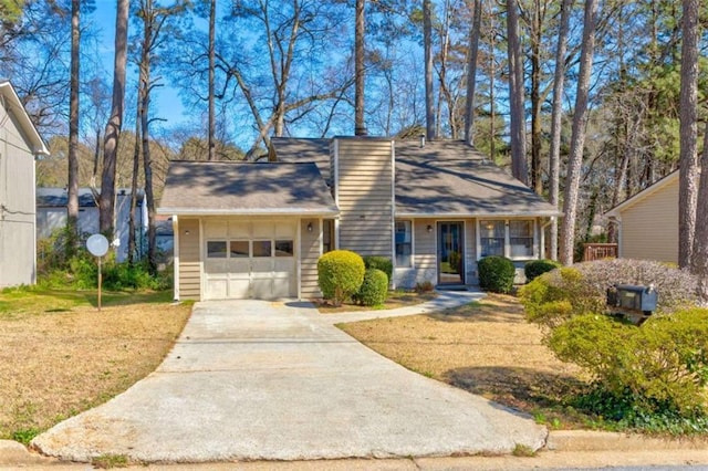 2211 Jonathan Ave, Lithonia, GA 30058 - view of front of property with a garage, concrete driveway, and a front yard