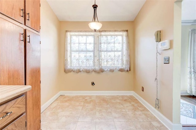 2211 Jonathan Ave, Lithonia, GA 30058 - unfurnished dining area featuring baseboards and light tile patterned floors