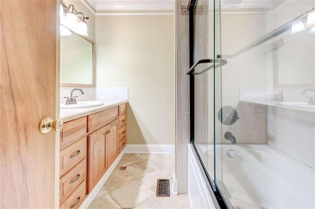 2211 Jonathan Ave, Lithonia, GA 30058 - bathroom with combined bath / shower with glass door, crown molding, vanity, and baseboards