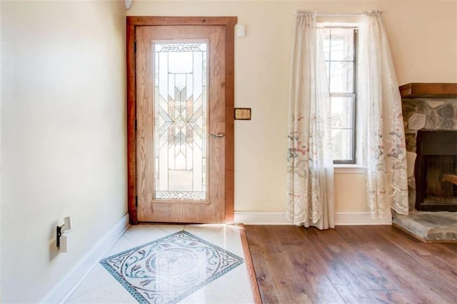 2211 Jonathan Ave, Lithonia, GA 30058 - entrance foyer with plenty of natural light, baseboards, and wood finished floors