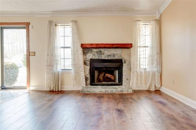 2211 Jonathan Ave, Lithonia, GA 30058 - unfurnished living room with hardwood / wood-style floors, a fireplace, baseboards, and ornamental molding