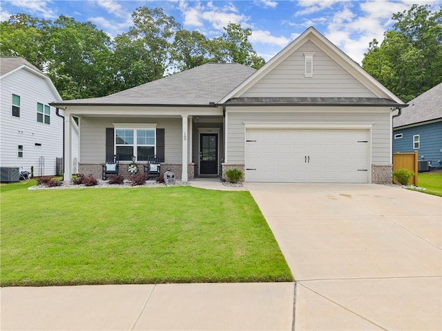 view of front facade featuring brick siding, a porch, a front lawn, concrete driveway, and an attached garage