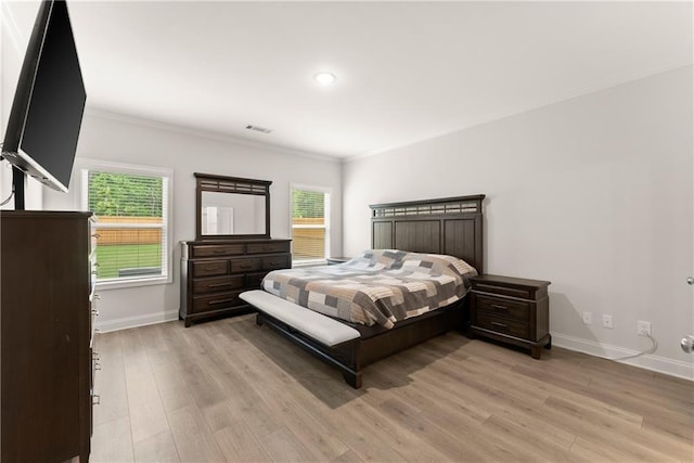 bedroom with ornamental molding, baseboards, light wood-type flooring, and recessed lighting