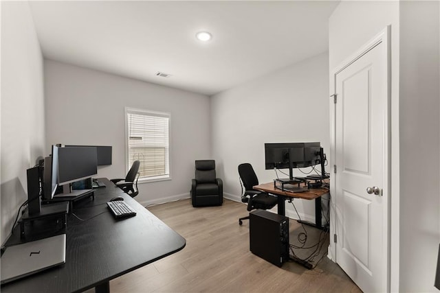 office area featuring light wood-type flooring, baseboards, and recessed lighting