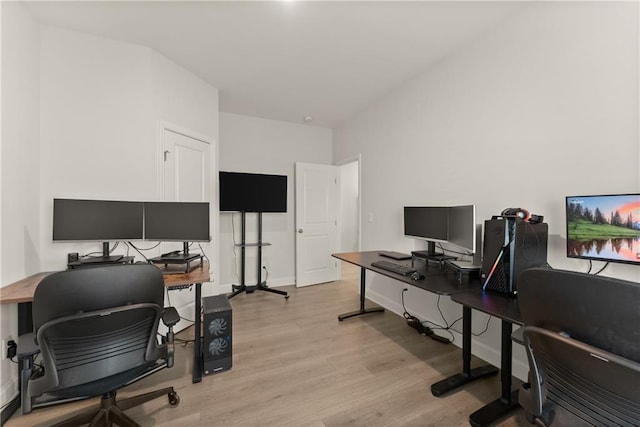 office featuring light wood-style flooring and baseboards