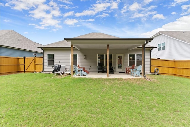 back of property with a patio