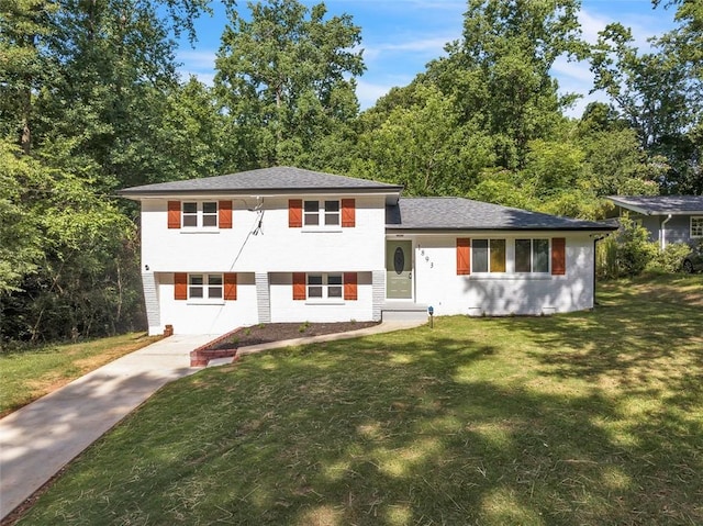 1893 Burning Tree Dr, Decatur, GA 30032 - tri-level home featuring concrete driveway and a front yard